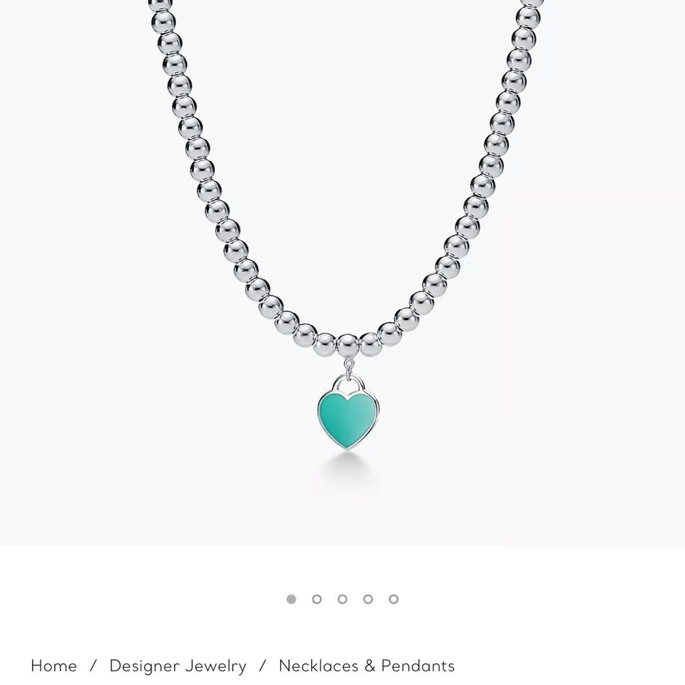 Tiffany beaded necklace with charm.  Receipt included!